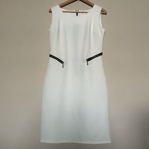 COPY - Chic and modern white fitted a-line dress with faux zipper pocket detail…